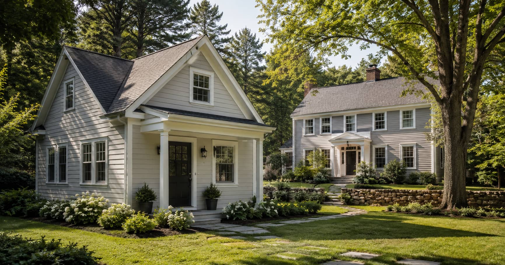 Detached accessory dwelling unit beside a New England Colonial-style home
