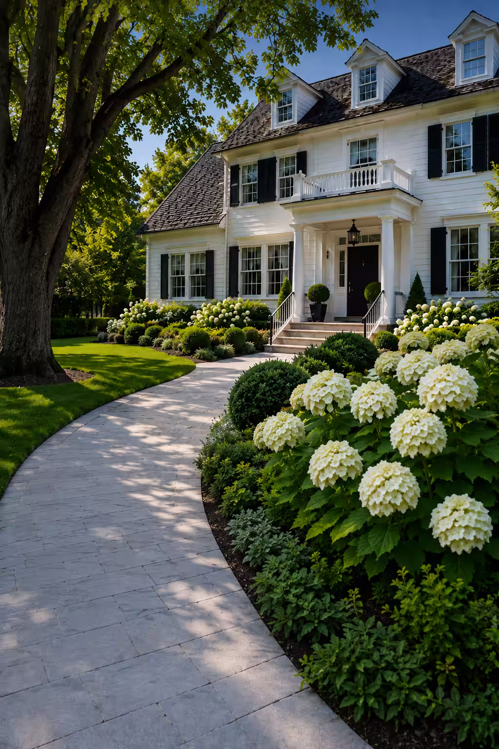 Sunny colonial-style home with landscaped front yard and curved stone walkway