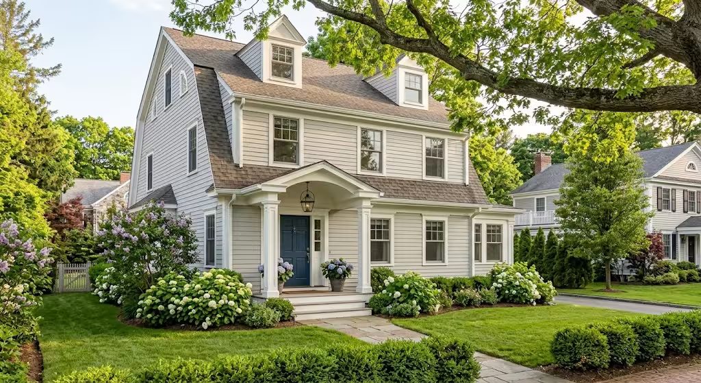 Classic New England home on a landscaped village street, representing the Wellesley Hills neighborhood style in Wellesley MA