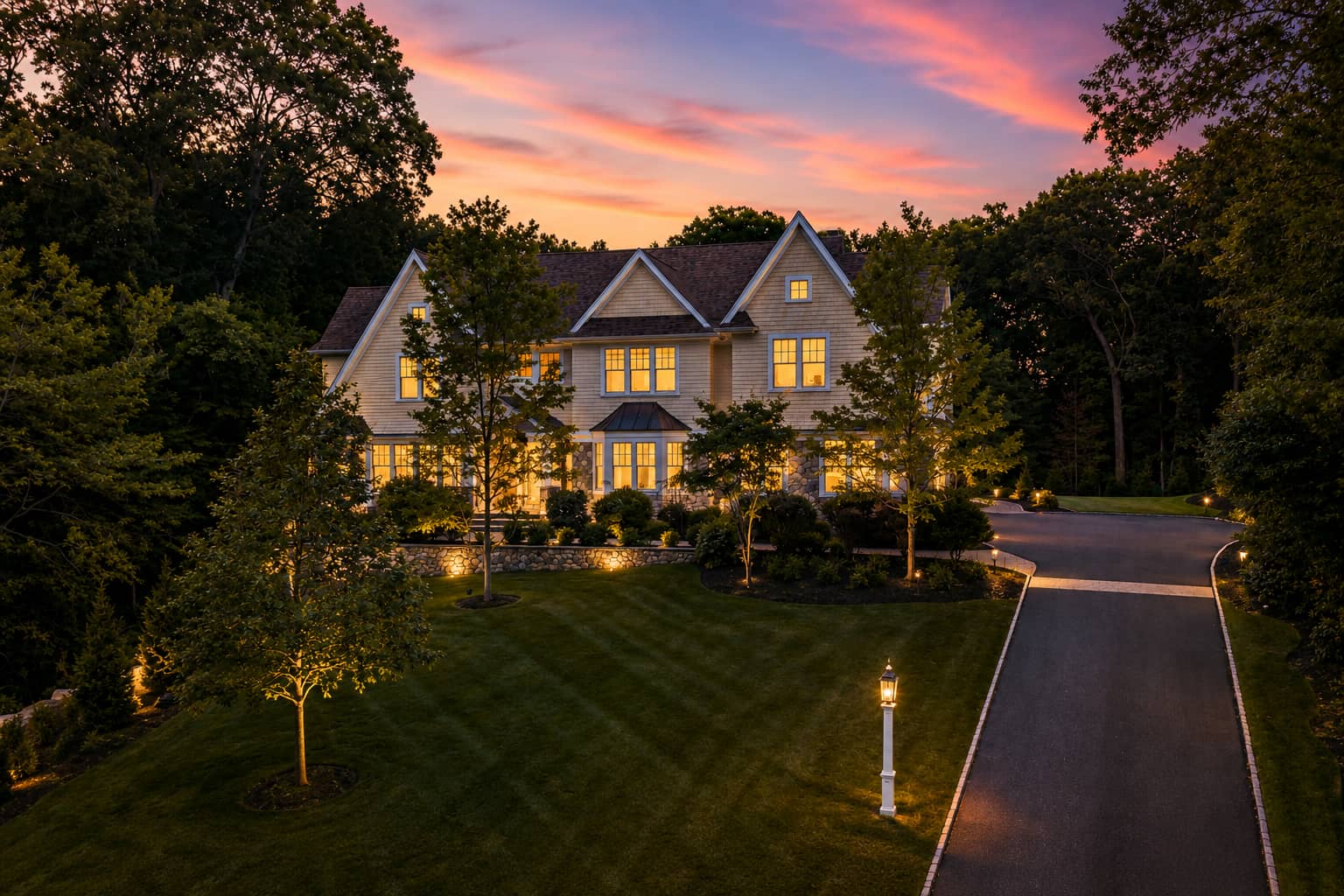 25 Holly Circle luxury home at twilight in Weston, MA